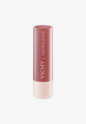 Vichy Natural Blend lip product in a cylindrical container, featuring a deep rose color and a cream-colored base with branded lettering.