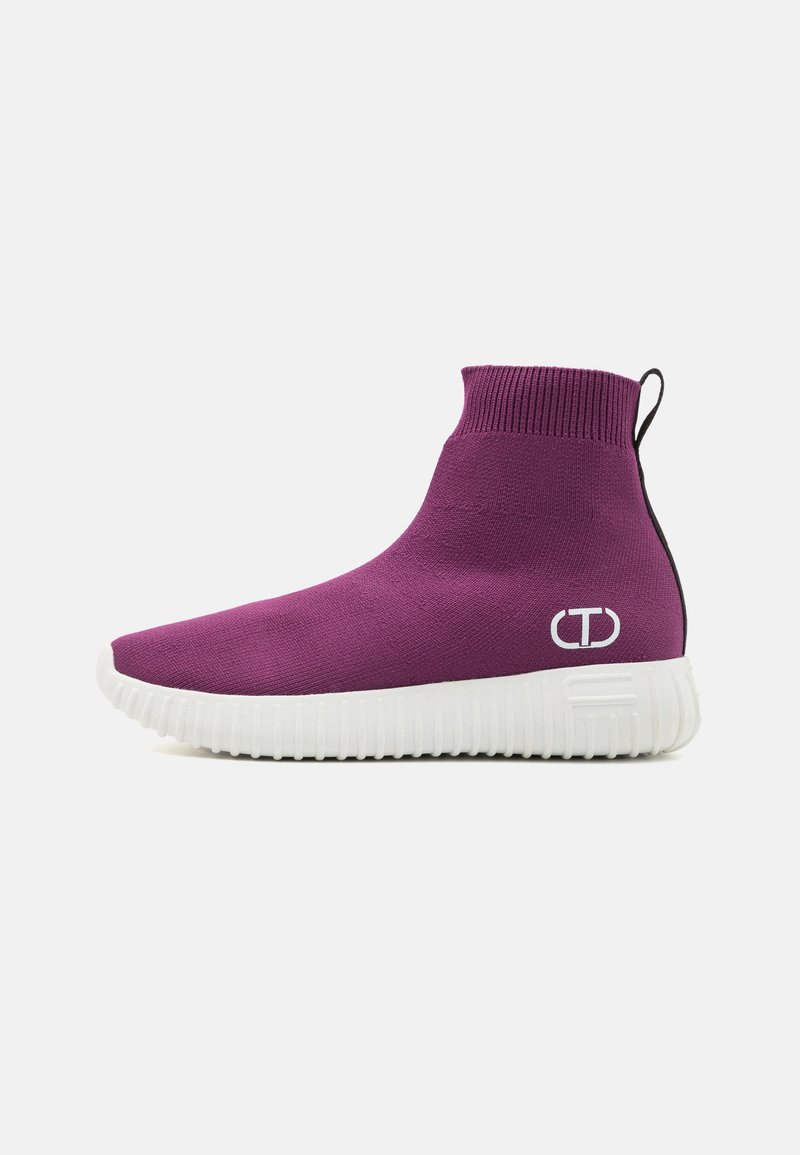 Purple knitted high-top sneaker with a white textured sole and black rear accent, featuring a logo on the outer side.