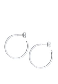 Orecchini a cerchio in argento con design minimalista, forma circolare e superficie liscia. Presentano una chiusura sicura con un piccolo dettaglio decorativo.