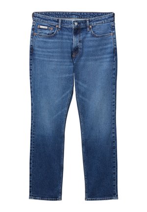 Μπλε τζιν με ίσια γραμμή, κλασικό σχέδιο με πέντε τσέπες, κούμπωμα με κουμπί και φερμουάρ, και ετικέτα Calvin Klein στην δεξιά μπροστινή τσέπη.