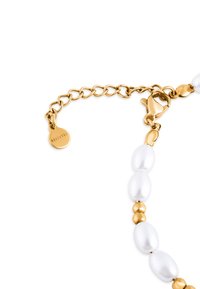 Kuldne kett-kaelakee, millel on valged ovaalsed pärlid ja kuldsed helmed. Karbi-kinnitus liikluse sulgemiseks ümmarguse märgiga.