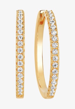 Goldene Creolen mit einer Reihe klarer Kristalle entlang der vorderen Kante, glatte Oberfläche und kreisförmige Form.