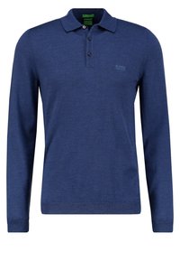 Polo à manches longues en bleu marine, fabriqué à partir d'un tissu doux, avec une patte de boutonnage à trois boutons et un petit logo sur la poitrine.