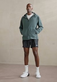 Nike Performance UNLIMITED - Tréning dzseki - vintage green/black