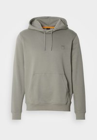 Sweat à capuche vert olive clair avec poche avant, cordons et petit logo carré sur le côté gauche de la poitrine.