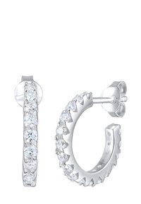 Sølv øreringe med en række klare, runde krystaller langs den ene side; poleret finish og en sikker post lukning.