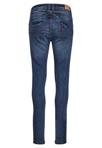 Jean slim en denim bleu foncé avec une texture lisse, cinq poches et des détails de couture subtils sur les poches arrière.