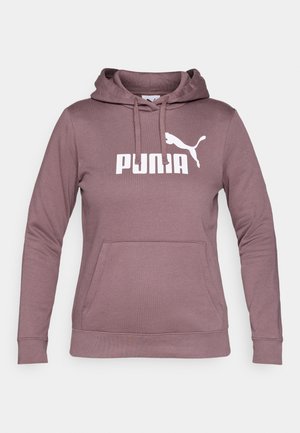Pulover kapuca v mauve barvi z sprednjim žepom, kapuco na vrvico in belim logotipom PUMA. Izdelan iz mehkega blaga z rebrastimi manšetami in robom.