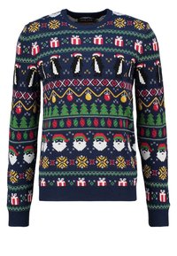 Pull de Noël bleu marine avec des pingouins, des visages de Père Noël, des sapins de Noël, des décorations et des cadeaux dans des motifs tricotés multicolores.