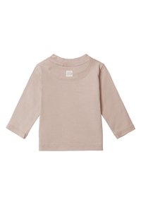 Lichtbeige langemouwen-top met een ronde halslijn, eenvoudig ontwerp, zachte katoenen stof en stikdetails langs de mouwen en de zoom.