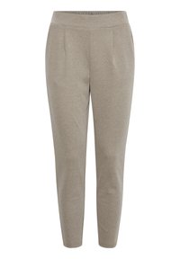 Pantalons beiges fuselés en tissu doux, avec une taille plate et deux plis à l'avant pour un détail de design supplémentaire.