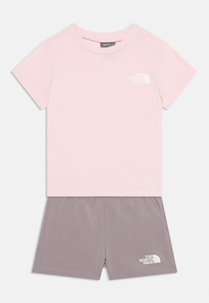 Kids' short-sleeve pink T-shirt with shoulder snaps and gray elastic waist shorts, both featuring The North Face logo.