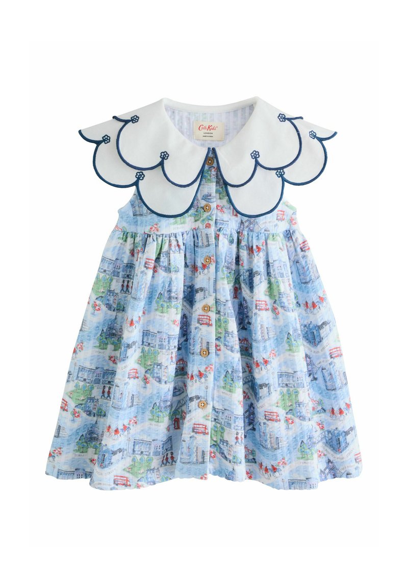 helehall sinine kleit, millel on trükitud linnasilueti muster, suur valge laineline krae tumesinise äärisega ja esiküljel nööpide detailid.