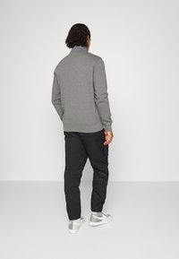 Nike Sportswear Chinos - black