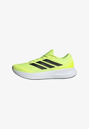 Scarpa da corsa giallo neon con strisce nere, suola bianca ammortizzata e tomaia leggera in mesh progettata per le prestazioni atletiche.