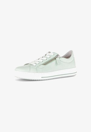 Low-top light green sneaker with white laces, side zipper, and white sole with green stripe, on white background.