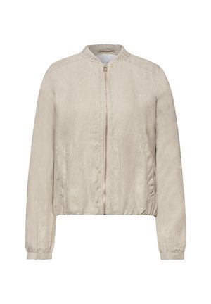 Blouson bomber beige clair zippé avec poignets, col et ourlet élastiqués, doté de deux poches latérales et d’un tissu texturé.