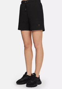 MUGGY - Pantaloni de trening - black