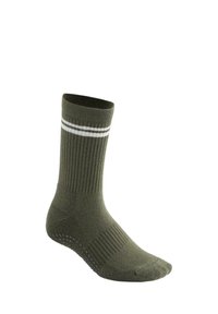 Olívazöld bordázott zokni fehér csíkos szegéllyel, gumírozott talppal, középmagas szárhosszal és sima textúrával.