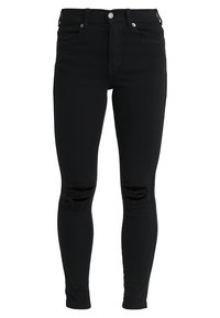 Svarta tajta jeans av denim med två slitna knäskärningar, femficksdesign och silverfärgad detalj framtill.