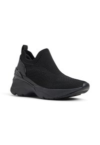 Black slip-on sneaker made of breathable mesh with a textured surface, a cushioned sole, and a slightly elevated heel.