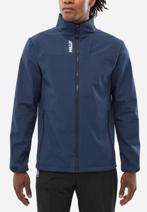 Veste imperméable bleu marine avec un col haut, fermeture éclair à l'avant et logo. Elle présente des poignets élastiques et des poches latérales, fabriquée en tissu durable.