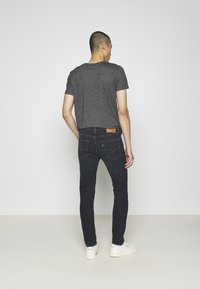 Levi's® 512® SLIM TAPER - Calças de ganga justas - shake the boat