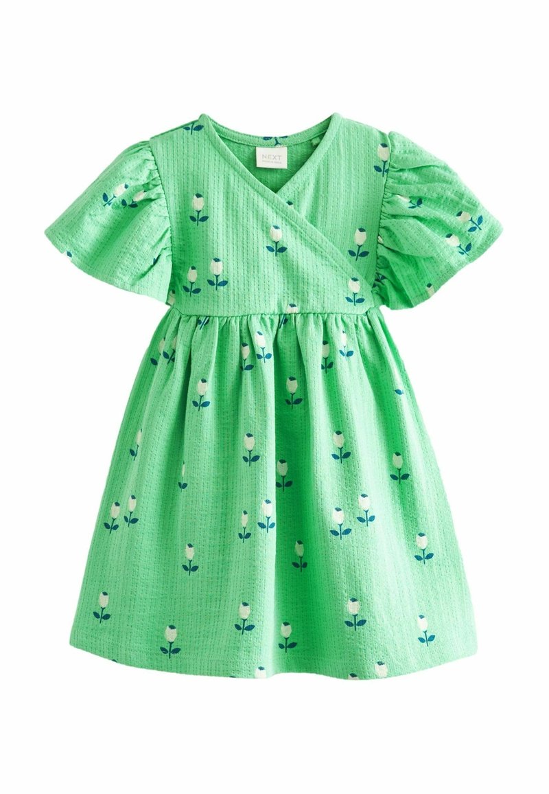 Robe verte pour tout-petit avec manches courtes bouffantes, devant croisé et motif floral blanc avec des feuilles bleues.