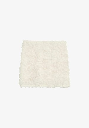 White decorative throw with a textured design, featuring raised fabric roses and a soft, fluffy appearance.