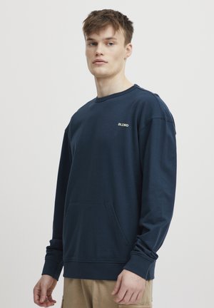 Marineblauwe sweatshirt van katoen, met een ronde hals, lange mouwen, geribbelde manchetten en een zak aan de voorkant met een klein logo.