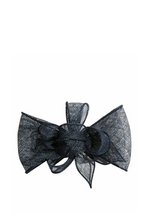 Accessoire nœud en tissu mesh noir avec des boucles et un nœud central, conçu pour une utilisation décorative sur les vêtements ou les cadeaux.