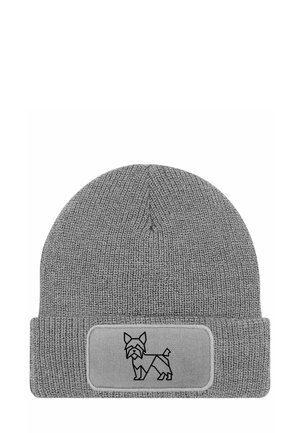 Gray knitted beanie with a folded cuff. Features a rectangular patch displaying a black line-drawing of a dog. Made of soft material.