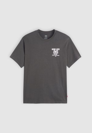 T-shirt en coton gris à manches courtes. Présente "GOOD LUCK" et un imprimé graphique à l'avant en blanc. Design standard avec col rond.