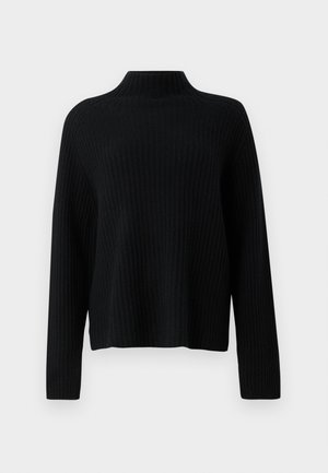 Pull noir en maille côtelée avec un col montant, des manches longues et une coupe décontractée. La texture est douce et légèrement extensible.