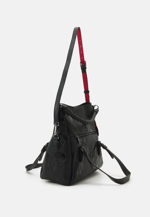 Black leather handbag with embossed Mickey Mouse patterns, braided handle, front zipper pocket, and adjustable strap with red underside.