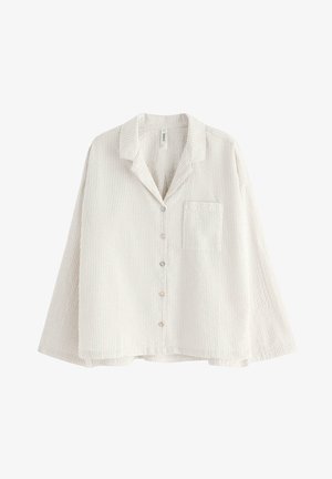 Chemise à boutons en beige clair avec un motif rayé pâle, coupe décontractée, manches longues, col et poche poitrine. Tissu à texture douce.