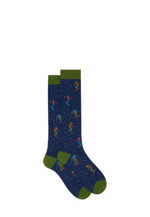 Calze fino al ginocchio in blu navy con polsini verdi, decorate con figure colorate di sciatori e fiocchi di neve su tutta la stoffa.