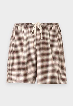 Shorts à carreaux vichy marron et blanc avec taille élastique et cordon blanc à nouer à l'avant, présentés sur un fond uni.