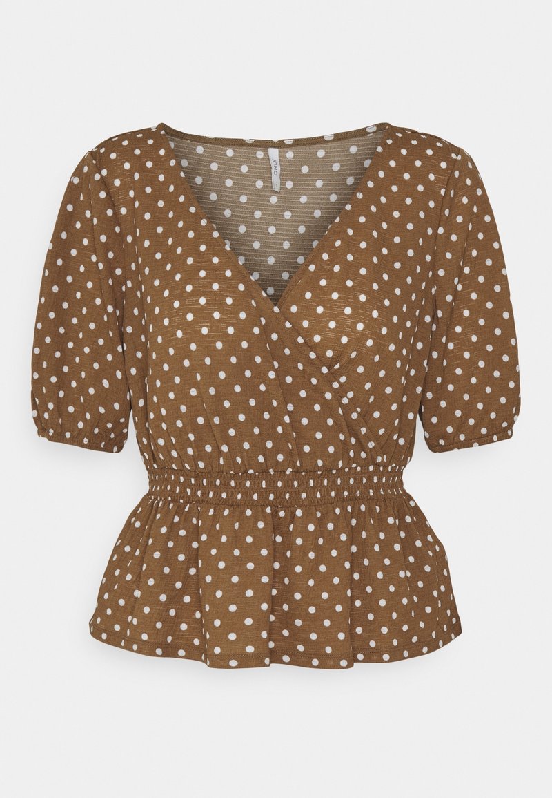 Blouse marron à manches courtes avec pois blancs, style cache-cœur à col en V, taille élastique et ourlet légèrement évasé.