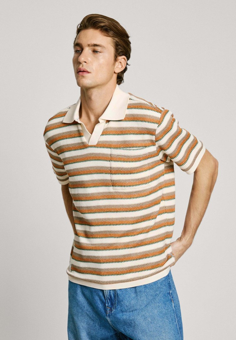 Striped polo shirt in beige, orange, and green. Features a soft texture, short sleeves, and a classic collar with a chest pocket.