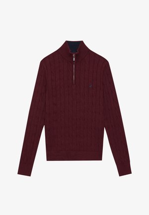 Burgundski pulover s pletenim uzorkom, sa patentnim zatvaračem na ovratniku i rebrastim manžetama. Ima kontrastnu mornarsko plavu unutrašnjost na ovratniku i mali logo.