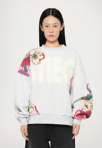 Gray sweatshirt featuring large embroidered floral patterns on one sleeve and bold "STIEG" text in yellow on the front.
