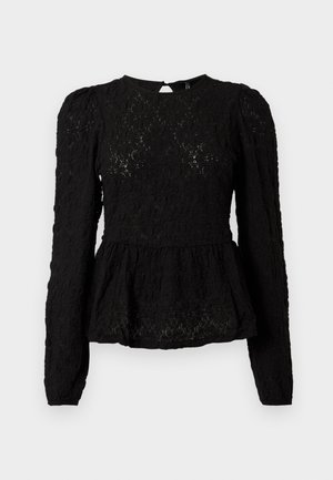 Blusa nera a maniche lunghe con motivo texturizzato, vita peplum e dettaglio a foro chiave sul retro. Realizzata in tessuto leggero e tessuto.