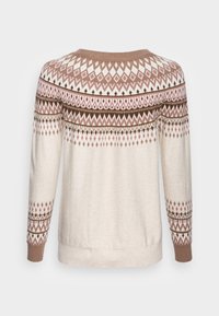 Cremefarbener Pullover mit geometrischem braun-rosa Muster. Gerippter Ausschnitt, Bündchen und Saum. Weicher Stoff, lockere Passform und lange Ärmel.