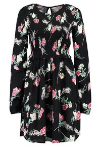 Svart klänning med långa ärmar, en smockad buste och blommönster i rosa och grönt. Nyckelhålsdetalj i ryggen, utsvängd kjol.