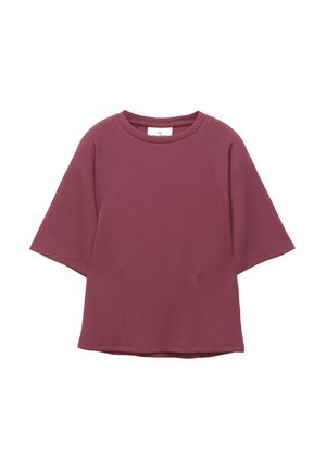 Bordeaux losse t-shirt met korte raglanmouwen, ronde halslijn, twee zijzakken en een gladde textuur. Geen zichtbare patronen of hardware.