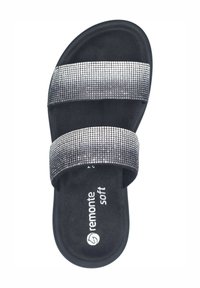 Black slide sandal with two metallic, rhinestone-accented straps, soft interior, and a textured sole featuring the brand name "remonte soft."