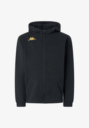 Hoodie zippé noir avec une texture douce, poches avant et un logo doré sur la poitrine gauche. Capuche ajustable avec des poignets côtelés.
