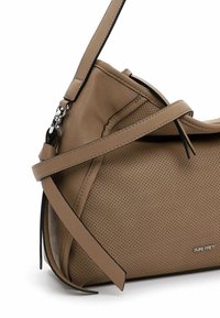 Tan leather shoulder bag with perforated texture, adjustable strap, black trim, and silver hardware. Features a minimalistic design.