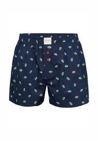Donkerblauwe boxers met een groen en zwart cirkelpatroon, voorzien van twee rode knopen en een elastische tailleband. Zachte stof textuur.